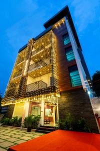 a building with a lot of lights on it at Daan Regency in Trichūr