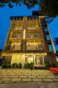 a building with a lot of lights on it at Daan Regency in Trichūr
