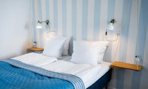 Postel nebo postele na pokoji v ubytování Aalbæk Badehotel