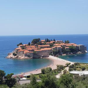 an island in the ocean with a resort at Vila Horizont in Sveti Stefan