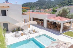 an aerial view of a house with a swimming pool at Rastoni - Relax & Retreat in Skala Potamias