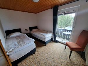 Postel nebo postele na pokoji v ubytování Blue Mountain Hotel
