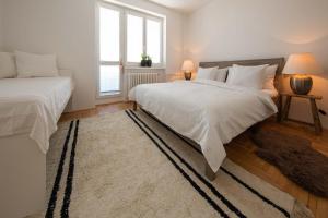Postel nebo postele na pokoji v ubytování apartmán NA NOC V BOHDANČI