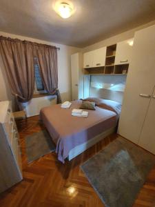 Postel nebo postele na pokoji v ubytování Apartman Stela