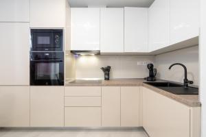 Kuchyň nebo kuchyňský kout v ubytování Apartman Stela
