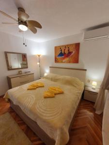 Postel nebo postele na pokoji v ubytování Apartman Stela