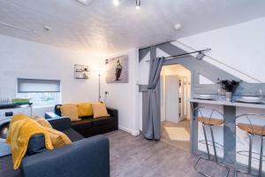 a living room with a couch and a table at DD Apartment 8 - Free Parking - Fast Wifi in Castle Donington