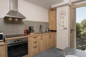 Kuchyň nebo kuchyňský kout v ubytování Aequor Luxury Rooms & Apartments
