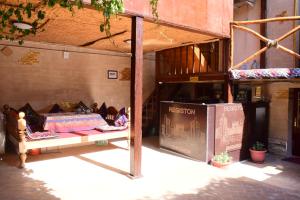 a room with a bed on display in a building at Hotel Registon Zargaron in Samarkand