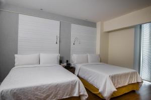 Letto o letti in una camera di BelAir Business Mexico City WTC, Trademark by Wyndham