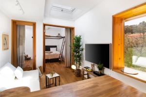 TV a/nebo společenská místnost v ubytování Apartments Kantunal