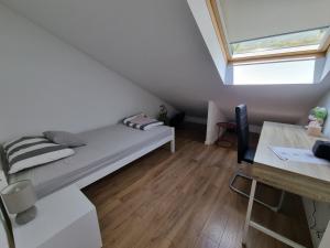 Postel nebo postele na pokoji v ubytování Geek Apartment