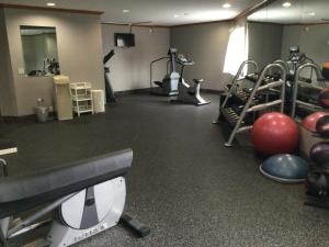 a gym with a bunch of machines and balls at Wingate by Wyndham Brighton in Brighton