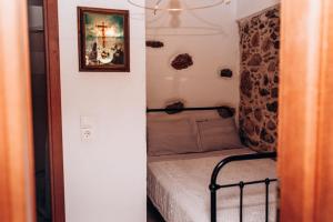 Postel nebo postele na pokoji v ubytování HILL SANDALI HOUSE