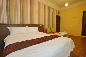 Uma cama ou camas num quarto em 輕旅小站 Soft Travel Hostel