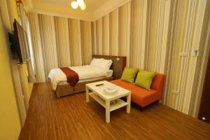 Uma televisão e/ou sistema de entretenimento em 輕旅小站 Soft Travel Hostel