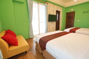Uma cama ou camas num quarto em 輕旅小站 Soft Travel Hostel