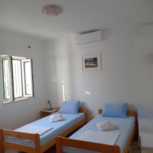 Ένα ή περισσότερα κρεβάτια σε δωμάτιο στο My Mediterranean Villa with Huge Garden and own Parking