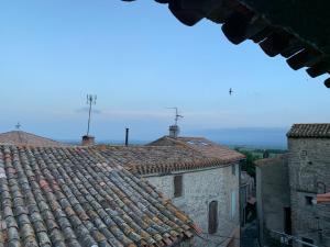 an view of an old building with tile roofs at La Maison de Leontine in La Livinière