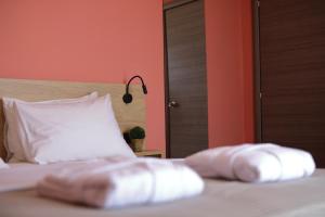 Posteľ alebo postele v izbe v ubytovaní CONTE CRISTO Suites