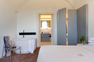 Postel nebo postele na pokoji v ubytování Ramo d'Aria Etna Boutique Hotel