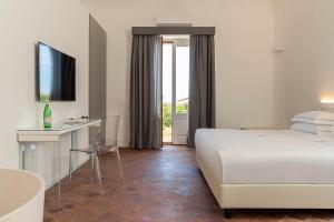 Postel nebo postele na pokoji v ubytování Ramo d'Aria Etna Boutique Hotel