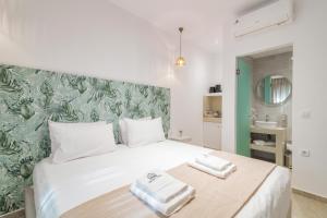 Posteľ alebo postele v izbe v ubytovaní Suncourt Lux Rooms