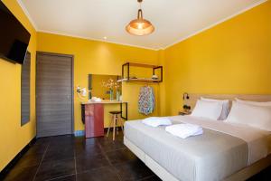 Posteľ alebo postele v izbe v ubytovaní CONTE CRISTO Suites