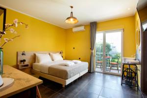 Posteľ alebo postele v izbe v ubytovaní CONTE CRISTO Suites