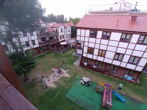 an aerial view of a yard with a playground at Apartament Nemo in Rowy