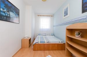 Postel nebo postele na pokoji v ubytování Apartments Damir