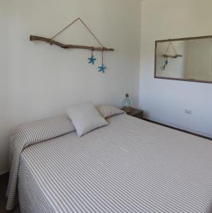 A bed or beds in a room at Terra dei Plautii