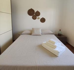 A bed or beds in a room at Terra dei Plautii