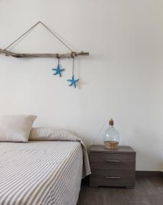 A bed or beds in a room at Terra dei Plautii