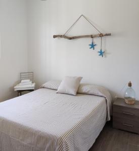A bed or beds in a room at Terra dei Plautii