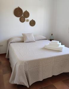 A bed or beds in a room at Terra dei Plautii