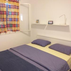 Posteľ alebo postele v izbe v ubytovaní Sea House