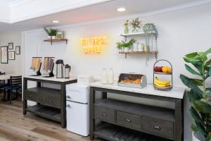 a kitchen with a breakfast station with fruits and vegetables at The Sojourn Los Angeles - Sherman Oaks in Sherman Oaks