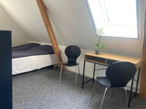 Postel nebo postele na pokoji v ubytování Residens Svalhøj