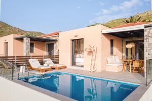 a villa with a swimming pool and a house at Lemnosthea Luxury Residences in Agios Ioannis Kaspaka