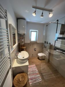 a bathroom with a sink and a toilet at Dom Lovrenko in Mlini +32 photos
