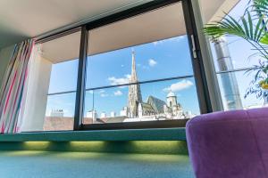 a window view of the spires of the city ofologne at Hotel König von Ungarn in Vienna