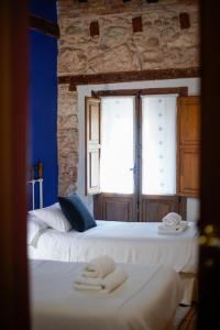 Postel nebo postele na pokoji v ubytování Hotel Rural El Zaguán