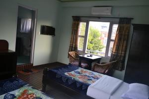 Giường trong phòng chung tại Nanohana Lodge