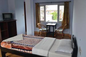 Giường trong phòng chung tại Nanohana Lodge