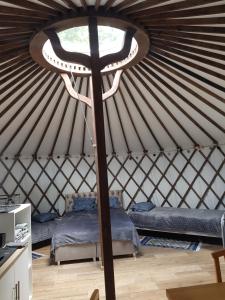 a room with two beds in a yurt at Skały Spały - Jurta in Przesieka