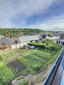 an aerial view of a farm with crops at Les Mouettes. Appart Honfleur 4 personnes vue pont de Normandie in Honfleur