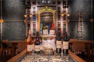 a bunch of bottles of wine sitting on a table at Narbona Wine Lodge in Carmelo