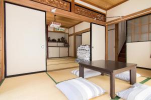 a japanese room with a table and a door at Siawase no yado - Vacation STAY 68283v in Fuefuki