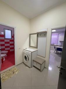 a washer and dryer in a room at MEGA Apartments in Fushë-Draç +61 photos